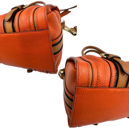 Angoli di un bauletto Burberry arancione usato, originale, in ottime condizioni, second hand.