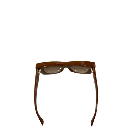 Vista superiore di un paio di occhiali da sole strutturati di Bottega Veneta color caramello e con lenti sfumate, usati, originali, second hand, in ottime condizioni.