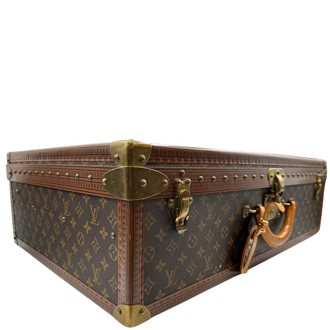 lato Valigia Alzer 70 in canvas monogram, munita di un accessorio porta address amovibile, di lusso, originale, ottime condizioni, usata. 