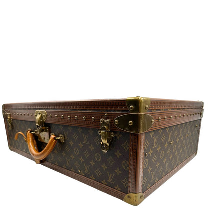 lato Valigia Alzer 70 in canvas monogram, munita di un accessorio porta address amovibile, di lusso, originale, ottime condizioni, usata.