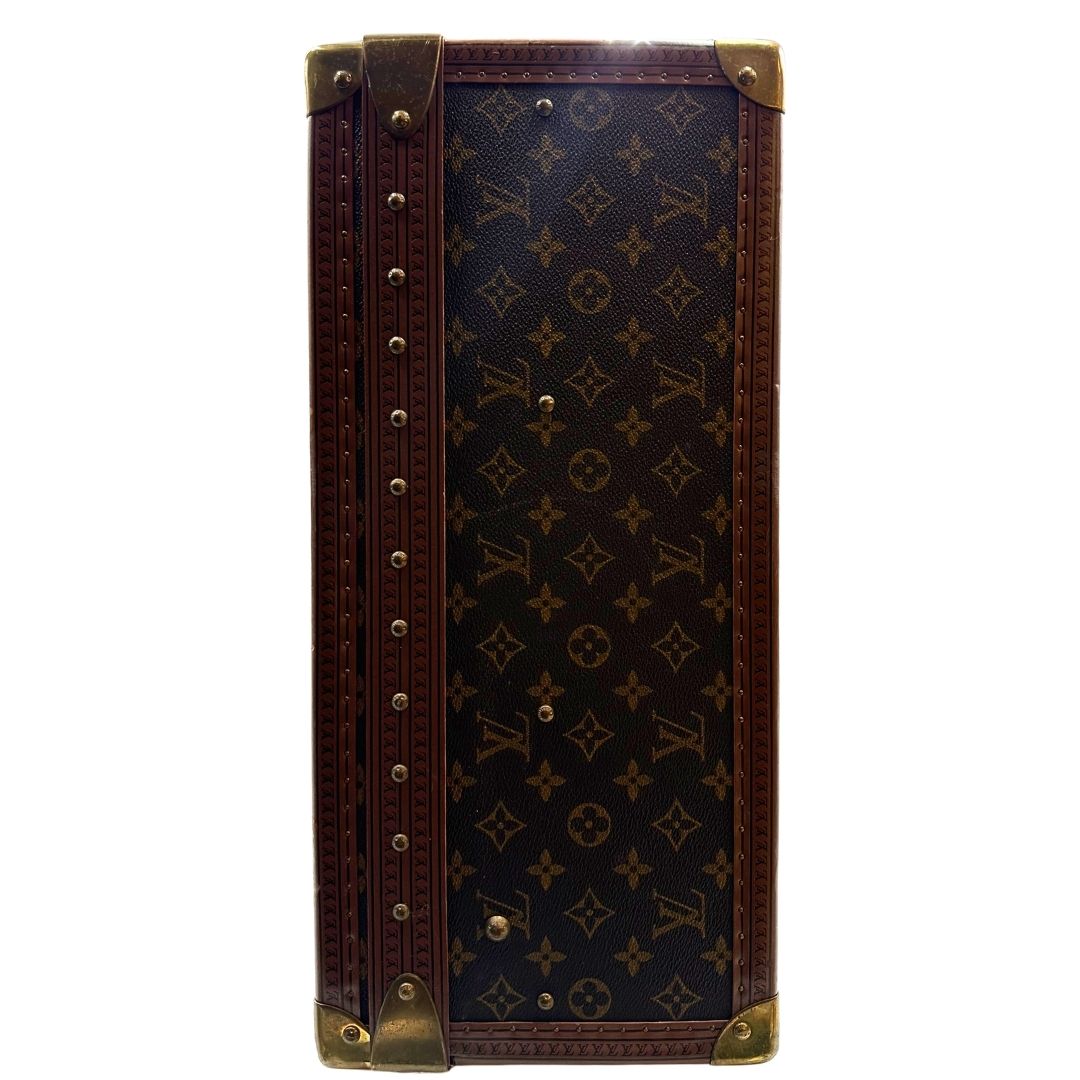lato Valigia Alzer 70 in canvas monogram, munita di un accessorio porta address amovibile, di lusso, originale, ottime condizioni, usata. 