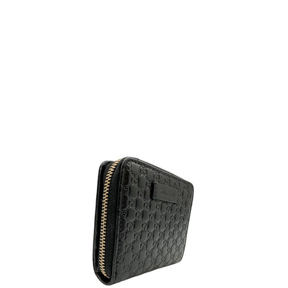 Lato destro, Portafoglio Gucci in pelle GG nera con hardware dorato. Originale, usato, di lusso, in ottime condizioni.