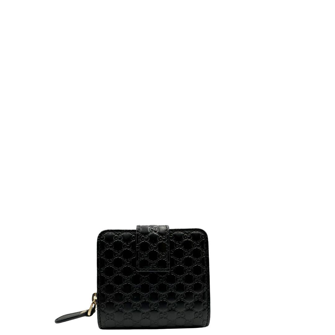 Retro, Portafoglio Gucci in pelle GG nera con hardware dorato. Originale, usato, di lusso, in ottime condizioni.