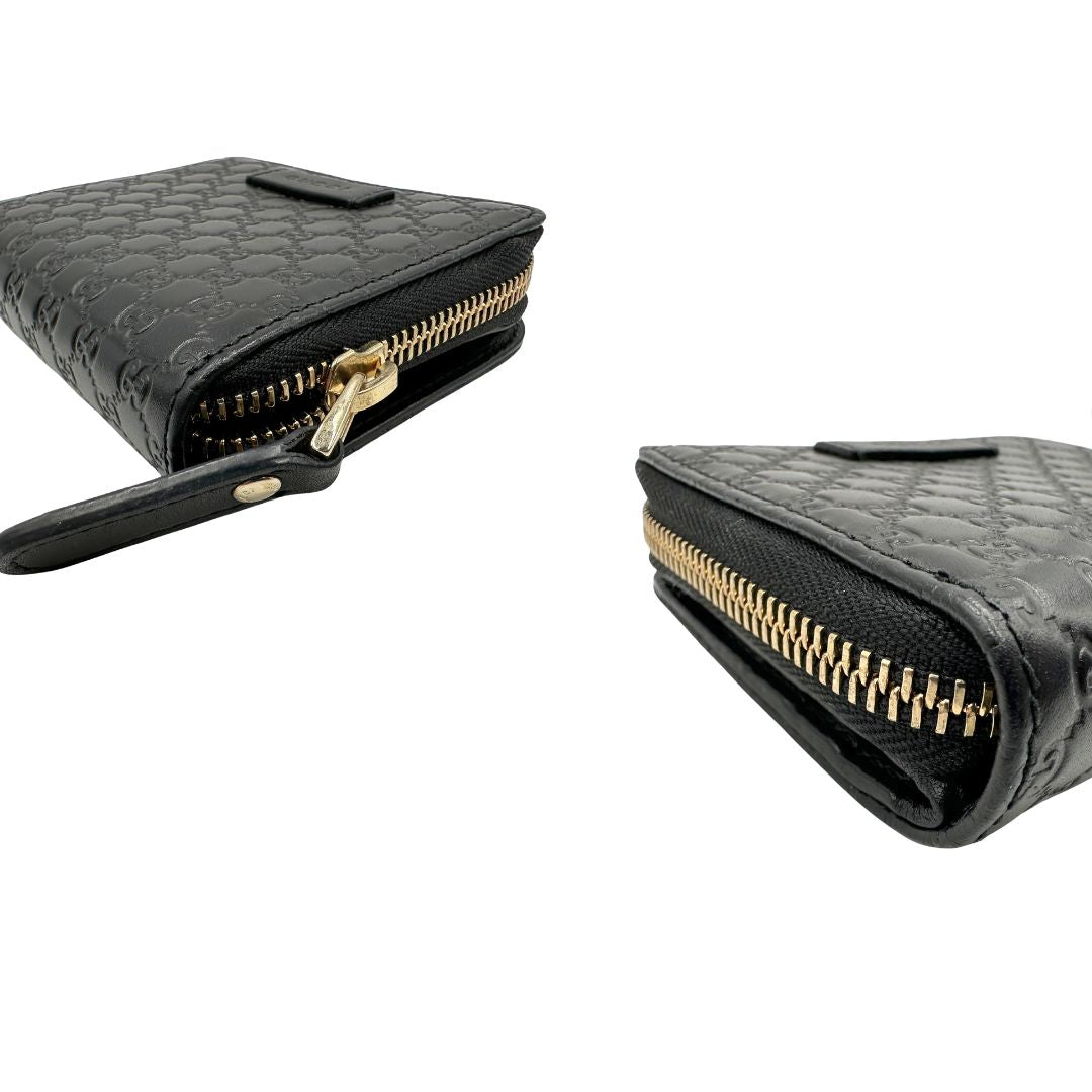 Angoli, Portafoglio Gucci in pelle GG nera con hardware dorato. Originale, usato, di lusso, in ottime condizioni.