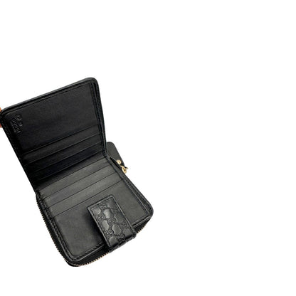 Interno, Portafoglio Gucci in pelle GG nera con hardware dorato. Originale, usato, di lusso, in ottime condizioni.