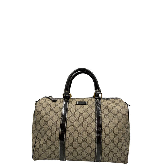 Front di un bauletto Gucci Supreme in canvas beige e dettagli in pelle marroni.