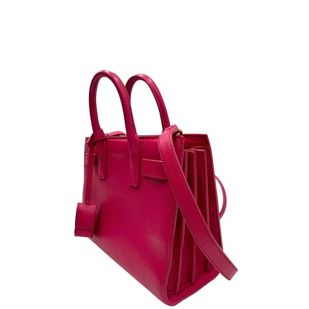 lato  Borsa Saint Laurent in pelle rosa, indossabile a tracolla o a mano, di lusso, originale, ottime condizioni, usata. 