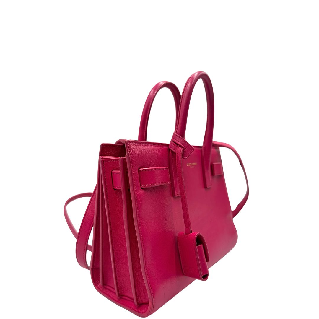 lato  Borsa Saint Laurent in pelle rosa, indossabile a tracolla o a mano, di lusso, originale, ottime condizioni, usata. 