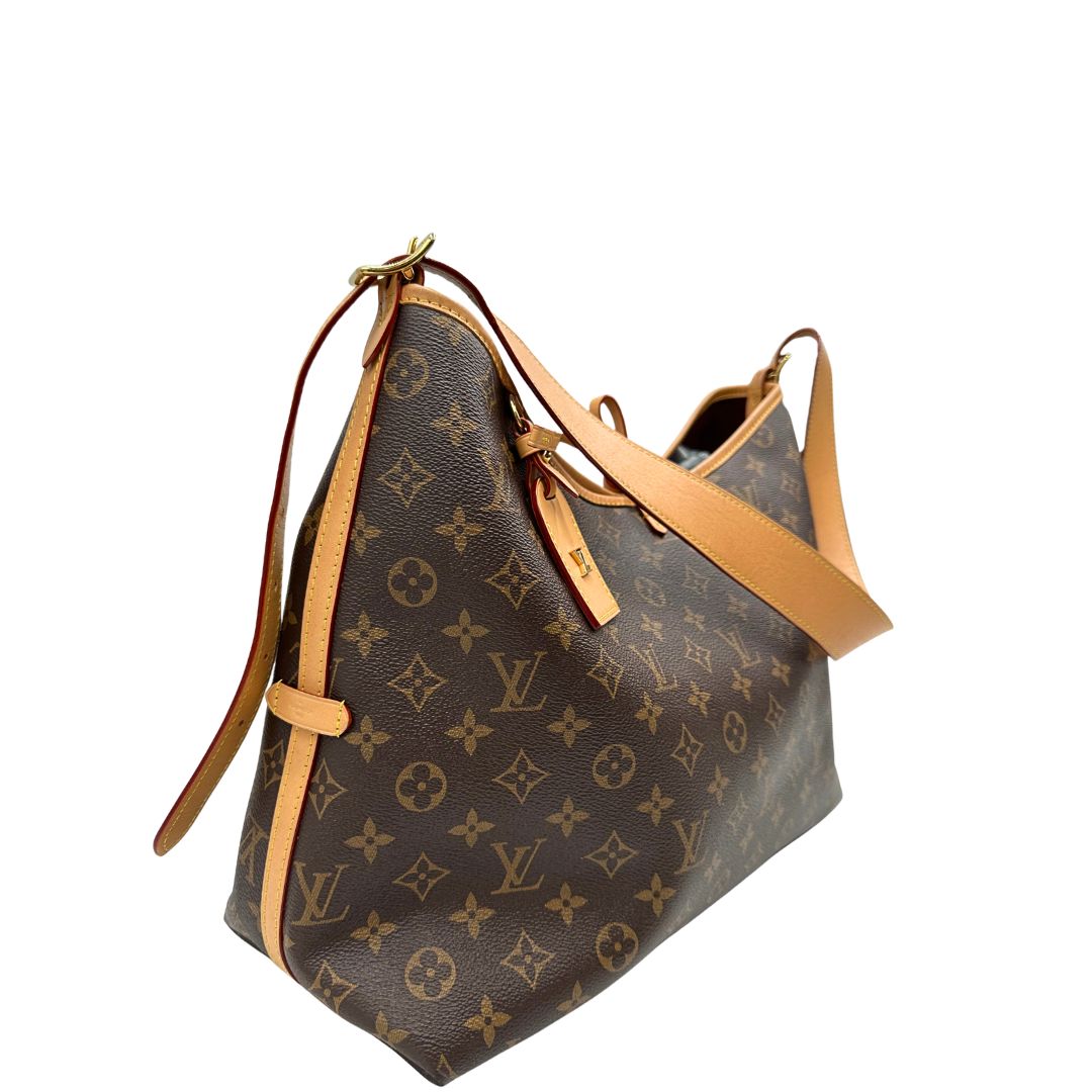 lato Borsa CarryAll MM  realizzata in tela Monogram e rifinita in pelle naturale, di lusso, originale, ottime condizioni, usata. 