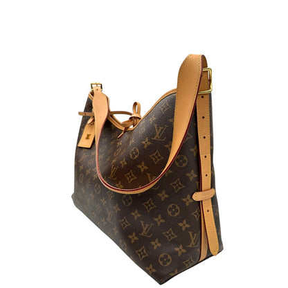 lato Borsa CarryAll MM  realizzata in tela Monogram e rifinita in pelle naturale, di lusso, originale, ottime condizioni, usata. 