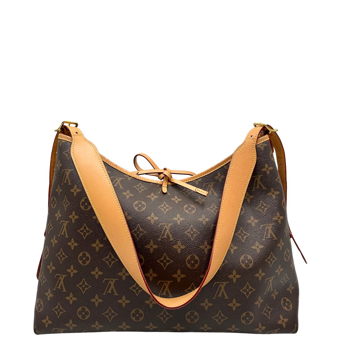 retro Borsa CarryAll MM  realizzata in tela Monogram e rifinita in pelle naturale, di lusso, originale, ottime condizioni, usata. 