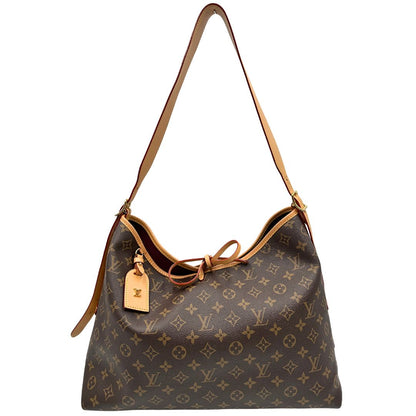 front Borsa CarryAll MM  realizzata in tela Monogram e rifinita in pelle naturale, di lusso, originale, ottime condizioni, usata. 