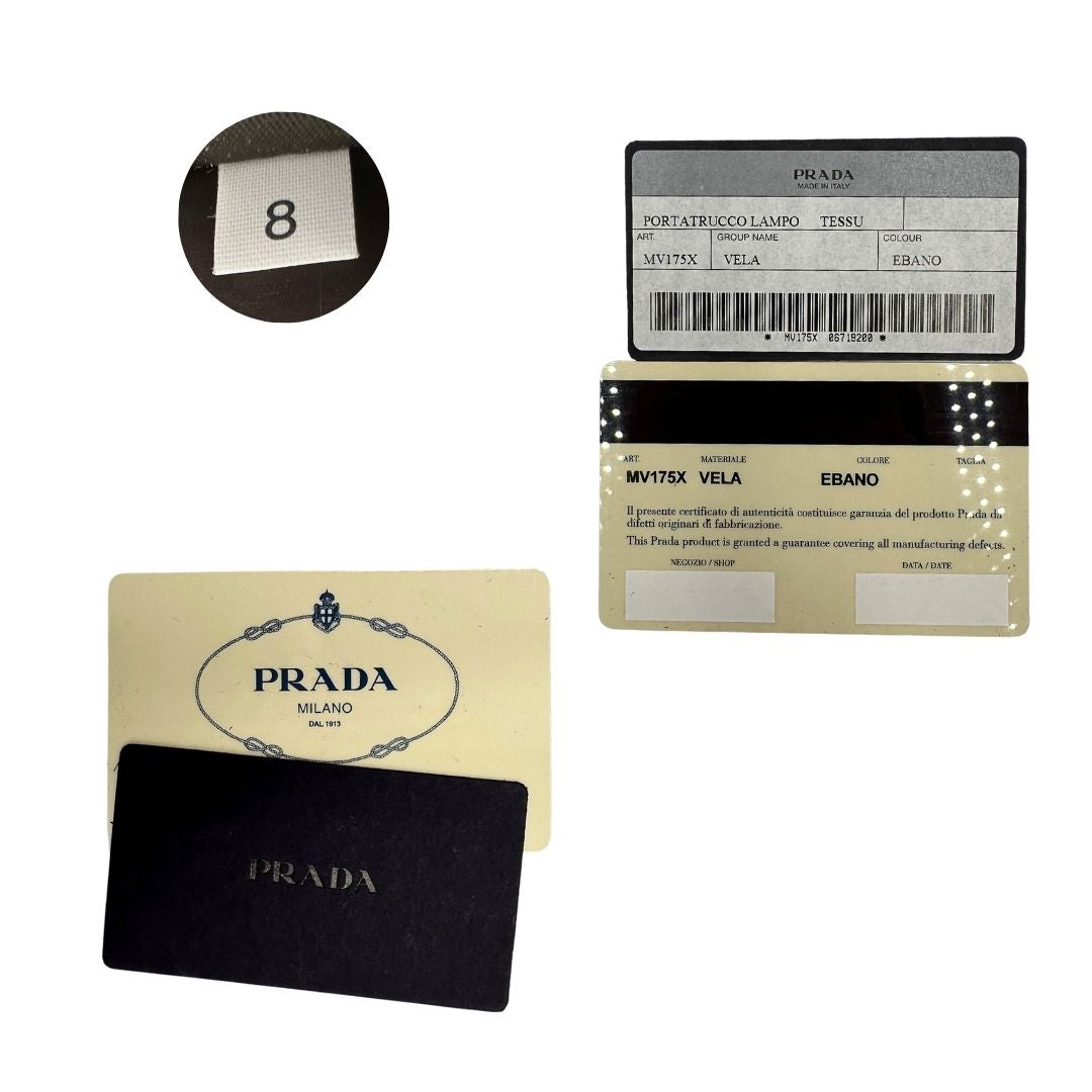 Card d'autenticità e codice di un beauty Prada in tessuto Vela color ebano e hardware argentato, usato, originale, second hand, in ottime condizioni.