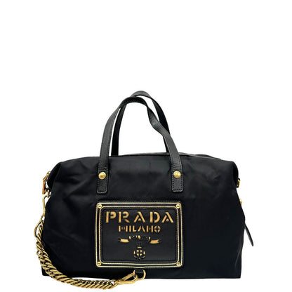Front di un bauletto Prada in tessuto vela e dettagli dorati, indossabile a mano, usato, originale, second hand, in ottime condizioni.