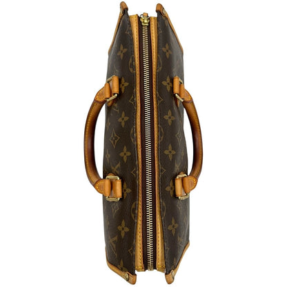 Vista superiore di una borsa LV Popincourt realizzata in tela Monogram con parti in vacchetta naturale, usata, originale, second hand, in ottime condizioni.