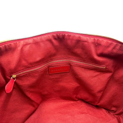 Interno di una shopper Burberry in canvas trama tartan con finiture in pelle bordeaux, usata, originale, second hand, in ottime condizioni.