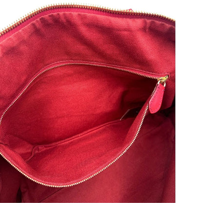 Interno di una shopper Burberry in canvas trama tartan con finiture in pelle bordeaux, usata, originale, second hand, in ottime condizioni.