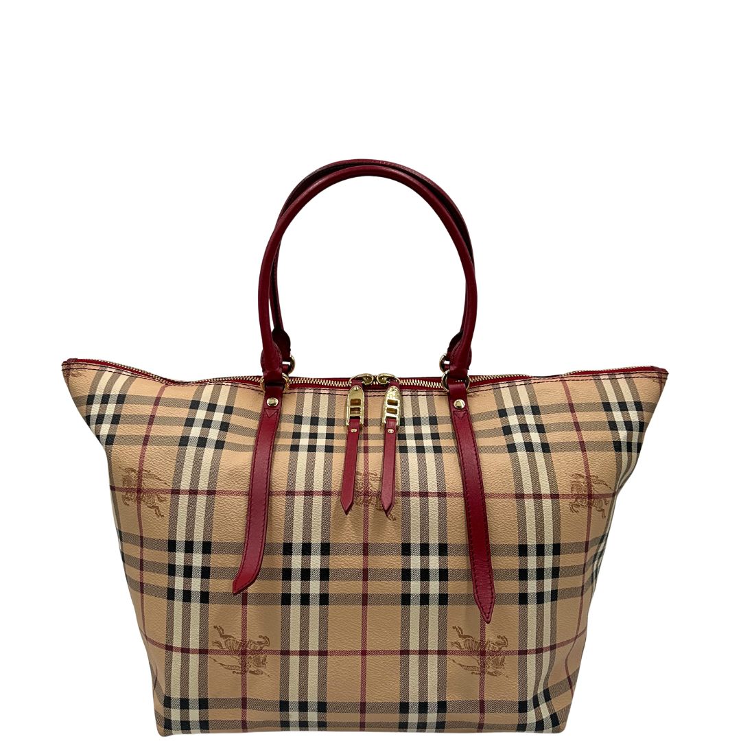 Front di una shopper Burberry in canvas trama tartan con finiture in pelle bordeaux, usata, originale, second hand, in ottime condizioni.