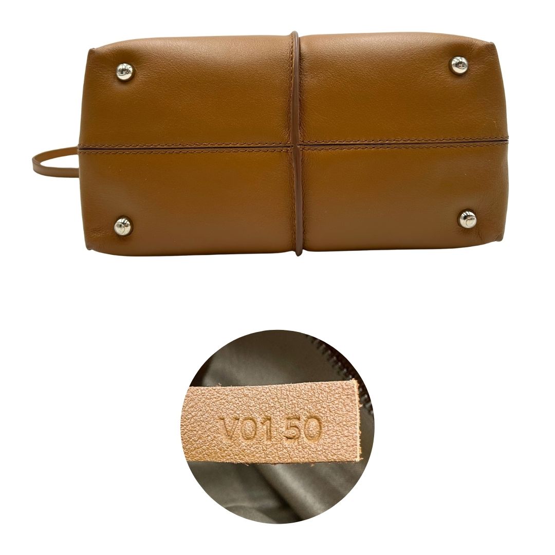 Base e codice, Borsa Tod's in morbida pelle color cammello e hardware argentato, indossabile a mano oppure a tracolla. Originale, usata, di lusso, in ottime condizioni.