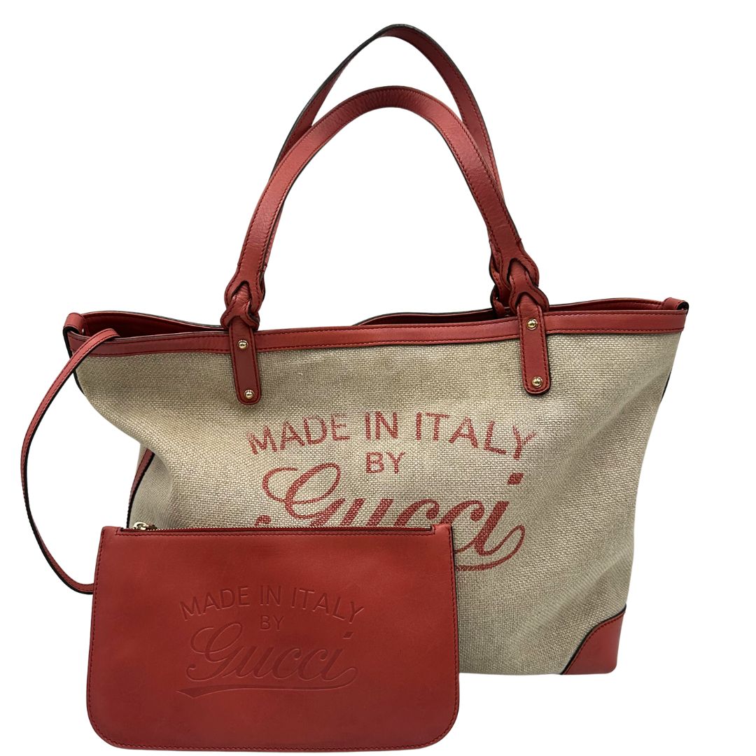 Front di una shopper Gucci Craft in tela beige, con finiture in pelle color rosa corallo. Dotata anche di una comoda pochette estraibile, usata, originale, second hand, in ottime condizioni.