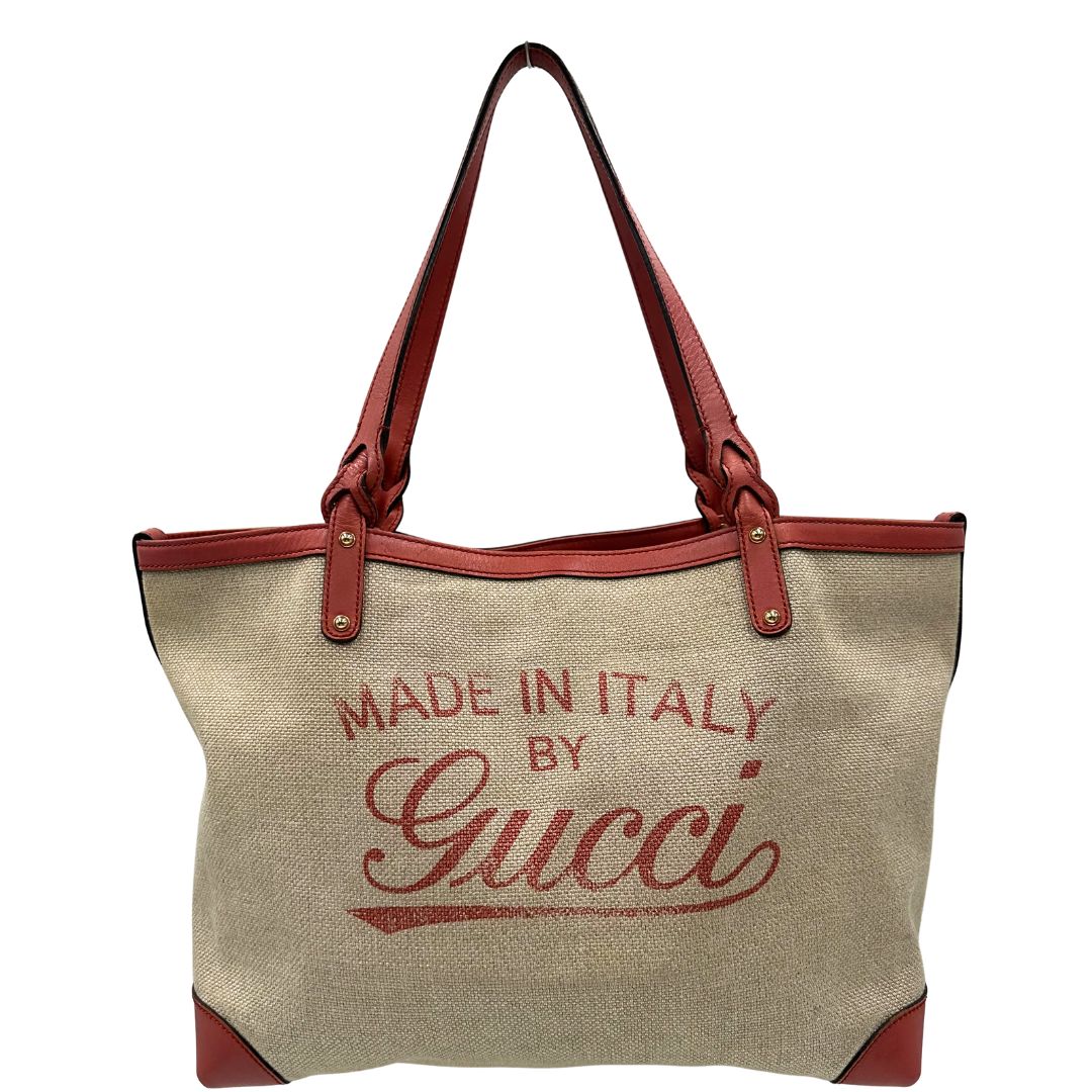 Front di una shopper Gucci Craft in tela beige, con finiture in pelle color rosa corallo. Dotata anche di una comoda pochette estraibile, usata, originale, second hand, in ottime condizioni.