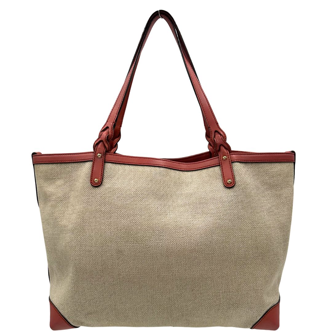 Retro di una shopper Gucci Craft in tela beige, con finiture in pelle color rosa corallo. Dotata anche di una comoda pochette estraibile, usata, originale, second hand, in ottime condizioni.