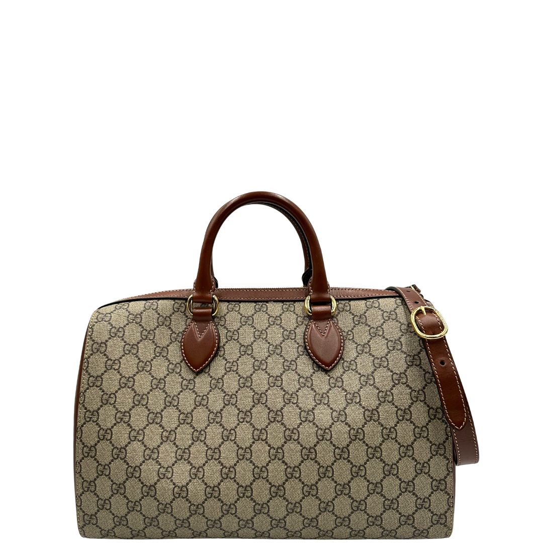 Front di un bauletto Gucci GG in canvas beige, con parti in pelle marroni, usato, originale, second hand, in ottime condizioni.