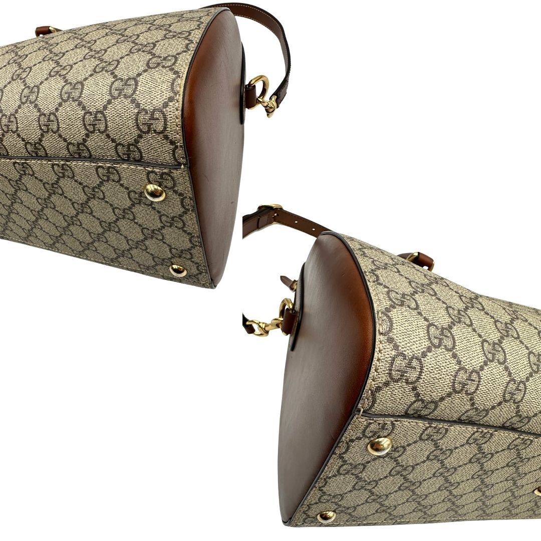 Angoli di un bauletto Gucci GG in canvas beige, con parti in pelle marroni, usato, originale, second hand, in ottime condizioni.