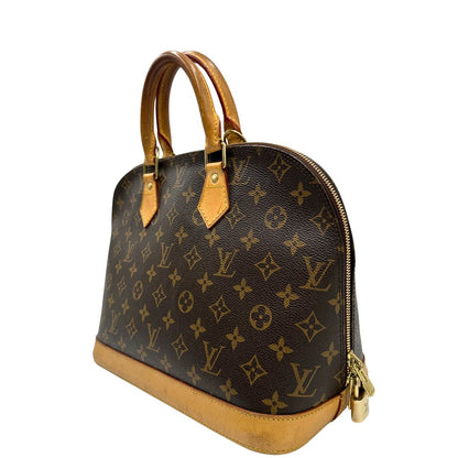 Laterale destro di una Louis Vuitton Alma in tela monogram nella versione PM, usata, originale, second hand, in ottime condizioni.