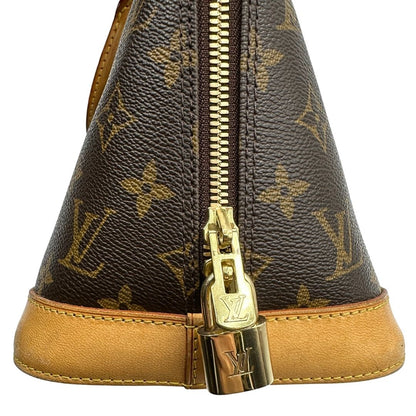 Laterale destro di una Louis Vuitton Alma in tela monogram nella versione PM, usata, originale, second hand, in ottime condizioni.