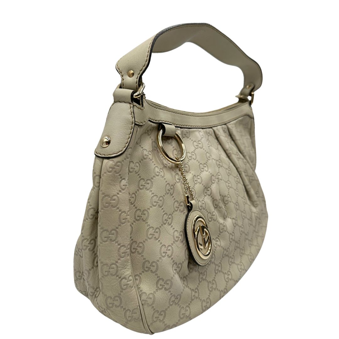lato borsa Gucci in morbida pelle color bianco avorio, di lusso, originale, ottime condizioni, usata.  