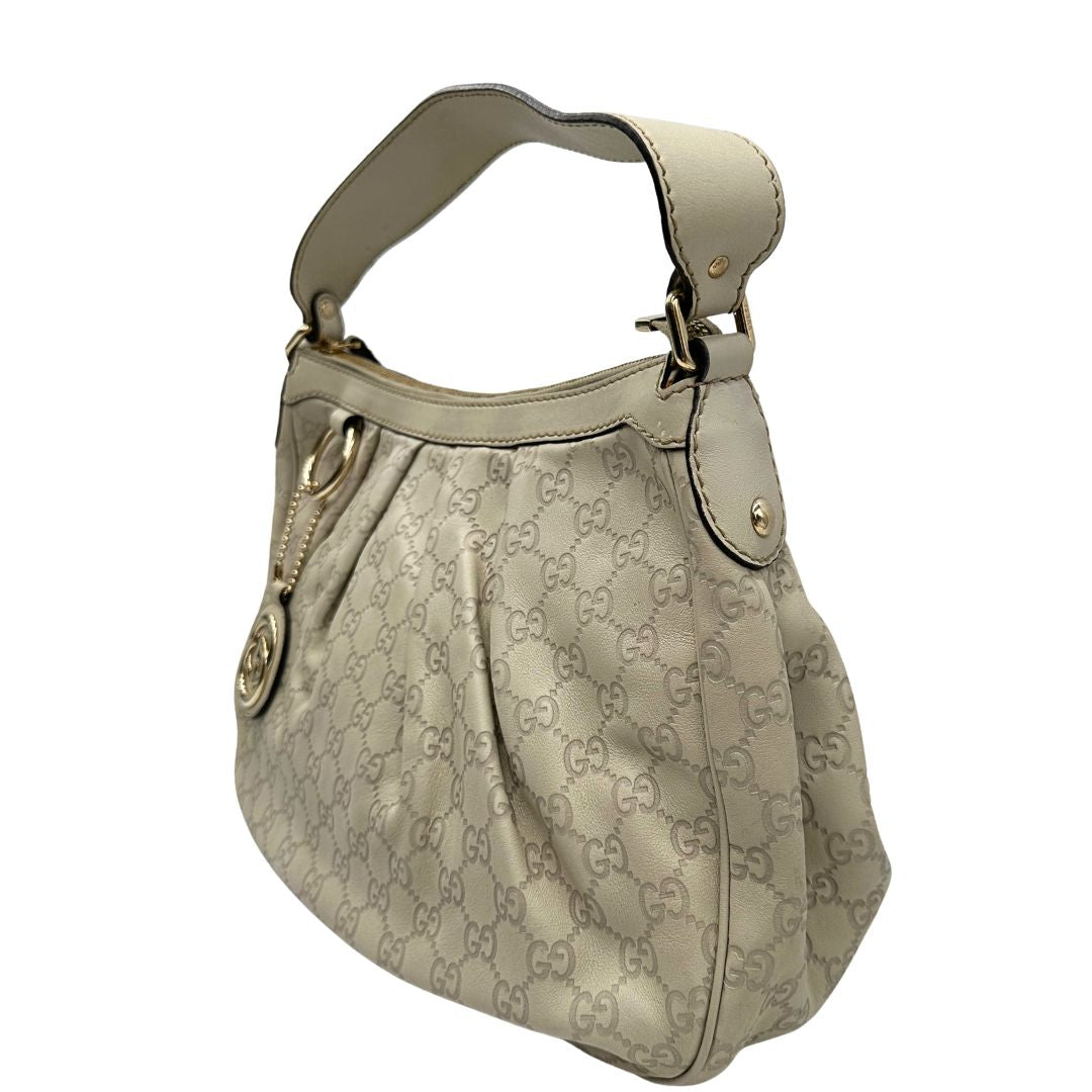 lato borsa Gucci in morbida pelle color bianco avorio, di lusso, originale, ottime condizioni, usata.  