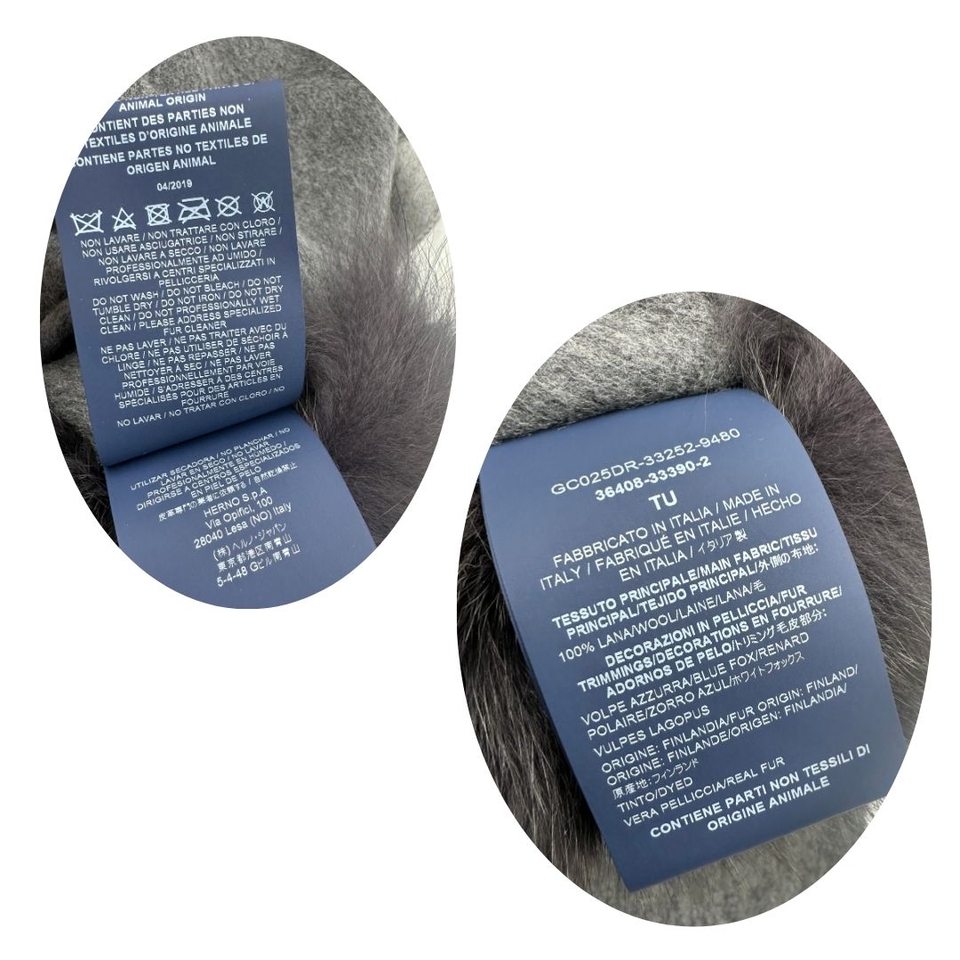 Etichette di un poncho Herno in morbida lana grigia con tasconi in pelliccia e bordi sfrangiati, usato, originale, second hand, in ottime condizioni.