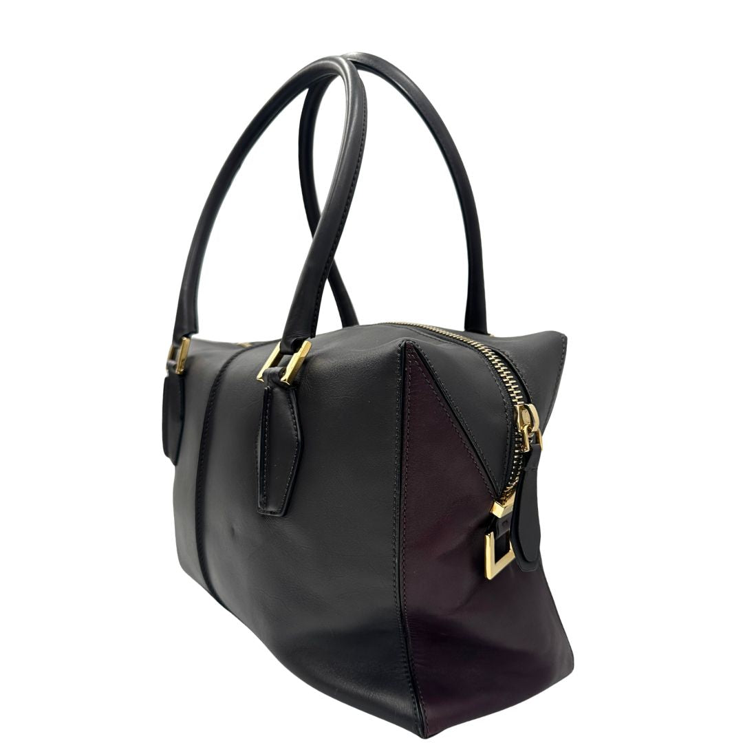 lato Bauletto Tod's in pelle color grigio antracite e viola melanzana, indossabile a spalla, di lusso, originale, ottime condizioni, usato.