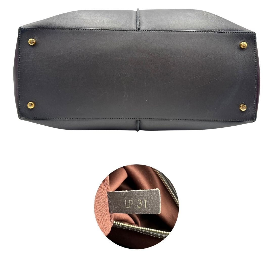 base Bauletto Tod's in pelle color grigio antracite e viola melanzana, indossabile a spalla, di lusso, originale, ottime condizioni, usato. 