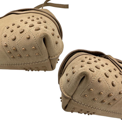 Angoli di una borsa con tracolla Tod's in pelle scamosciata beige, usata, originale, second hand, in ottime condizioni.
