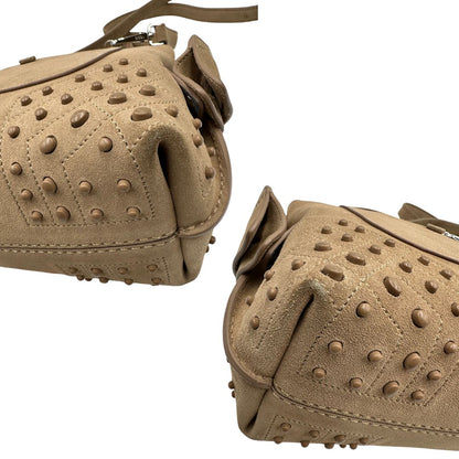 Angoli di una borsa con tracolla Tod's in pelle scamosciata beige, usata, originale, second hand, in ottime condizioni.