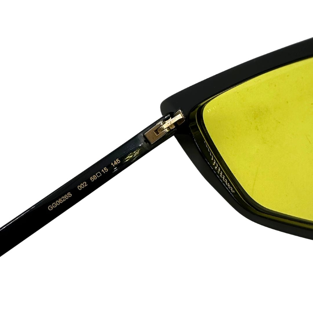 Occhiali da sole Gucci in acetato nero e lente gialla, di lusso, originale, usato.