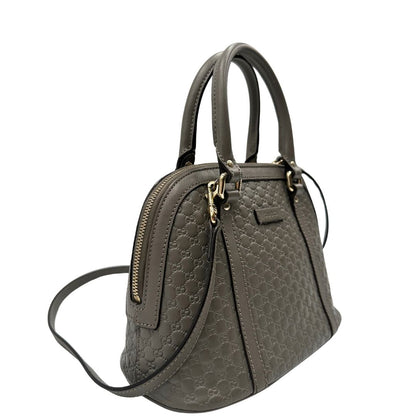 lato Borsa Gucci in pelle microgucissima grigia, di lusso, originale, ottime condizioni, usata. 
