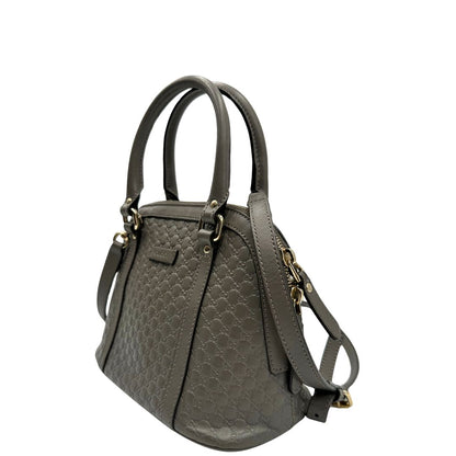 lato Borsa Gucci in pelle microgucissima grigia, di lusso, originale, ottime condizioni, usata.