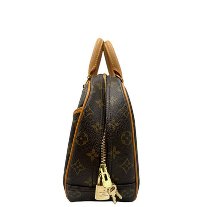 Laterale di una borsa LV Trouville in tela monogram e vacchetta naturale, usata, originale, second hand, in ottime condizioni.