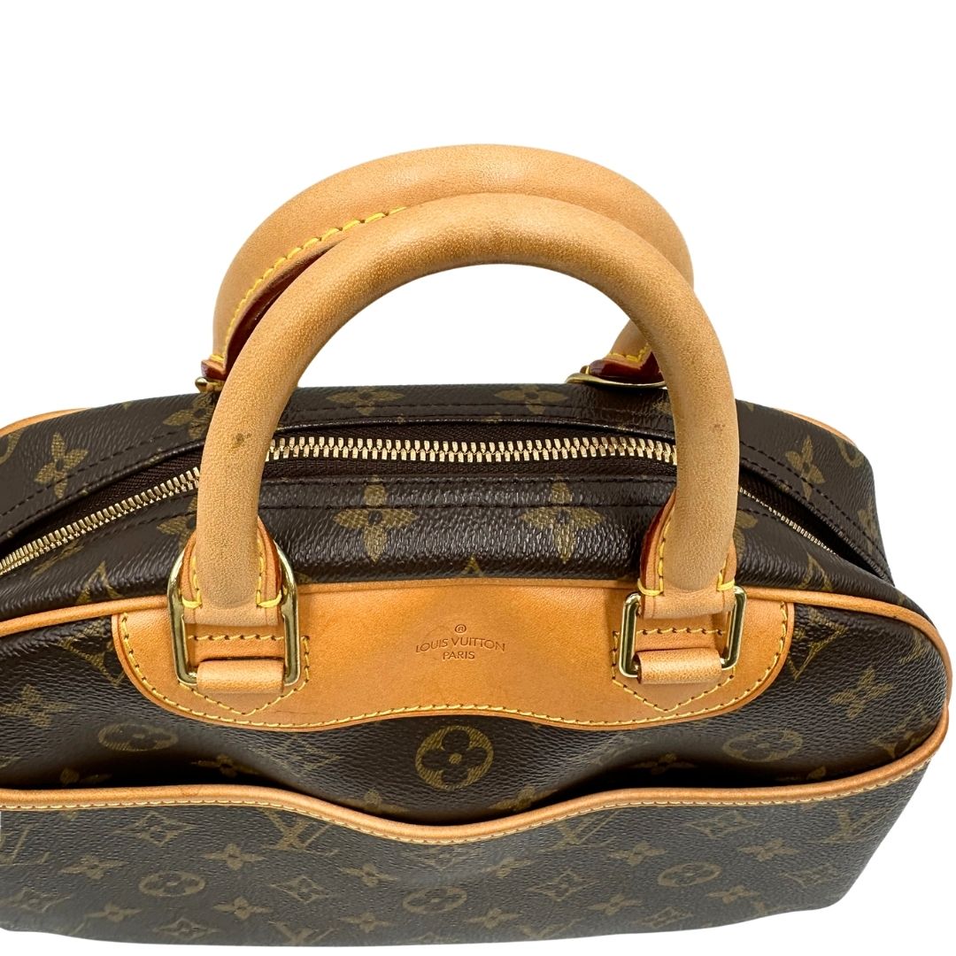 Manici di una borsa LV Trouville in tela monogram e vacchetta naturale, usata, originale, second hand, in ottime condizioni.