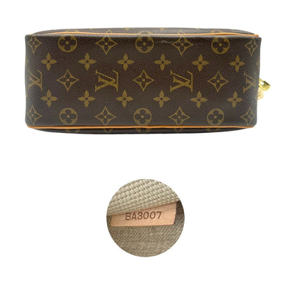 Base e codice di una borsa LV Trouville in tela monogram e vacchetta naturale, usata, originale, second hand, in ottime condizioni.