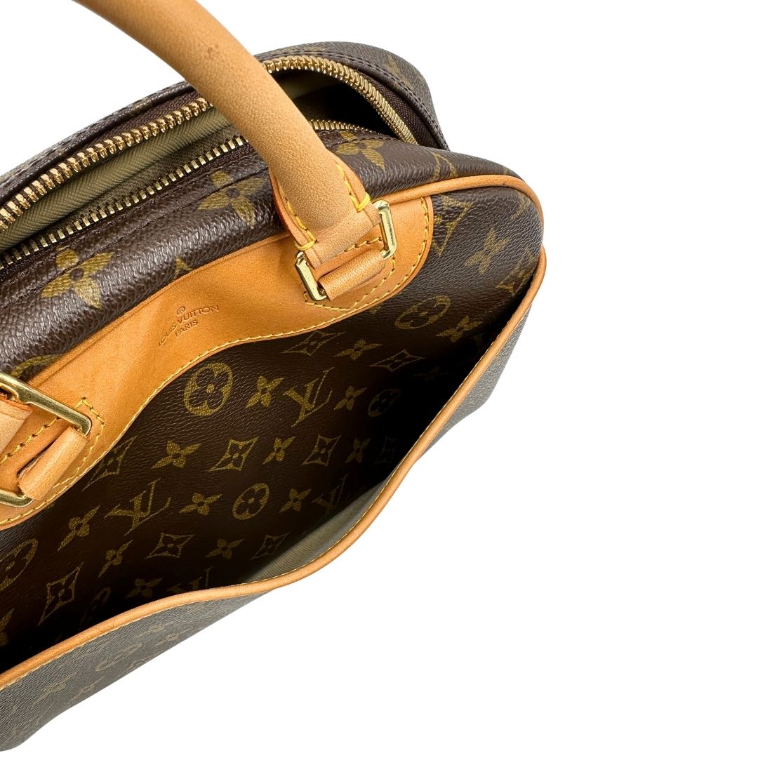 Manici di una borsa LV Trouville in tela monogram e vacchetta naturale, usata, originale, second hand, in ottime condizioni.