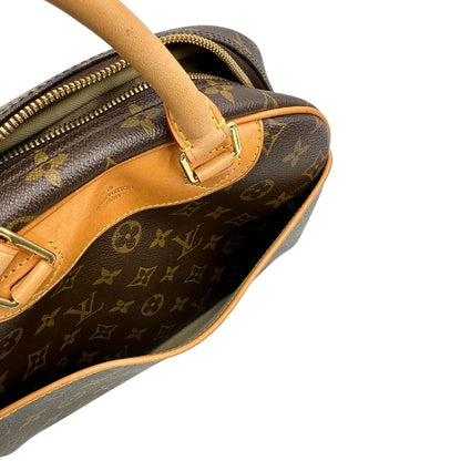 Manici di una borsa LV Trouville in tela monogram e vacchetta naturale, usata, originale, second hand, in ottime condizioni.