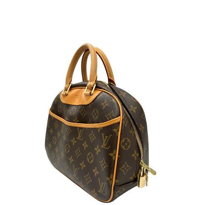 Laterale destro di una borsa LV Trouville in tela monogram e vacchetta naturale, usata, originale, second hand, in ottime condizioni.
