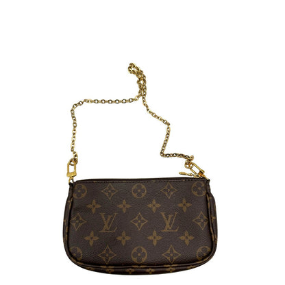 Multi Pochette Accessoires Louis Vuitton in canvas marrone monogram con dettagli in vacchetta naturale, manico in catena dorata e tracolla in tessuto Jacquard verde kaki, di lusso, originale, ottime condizioni, usata.