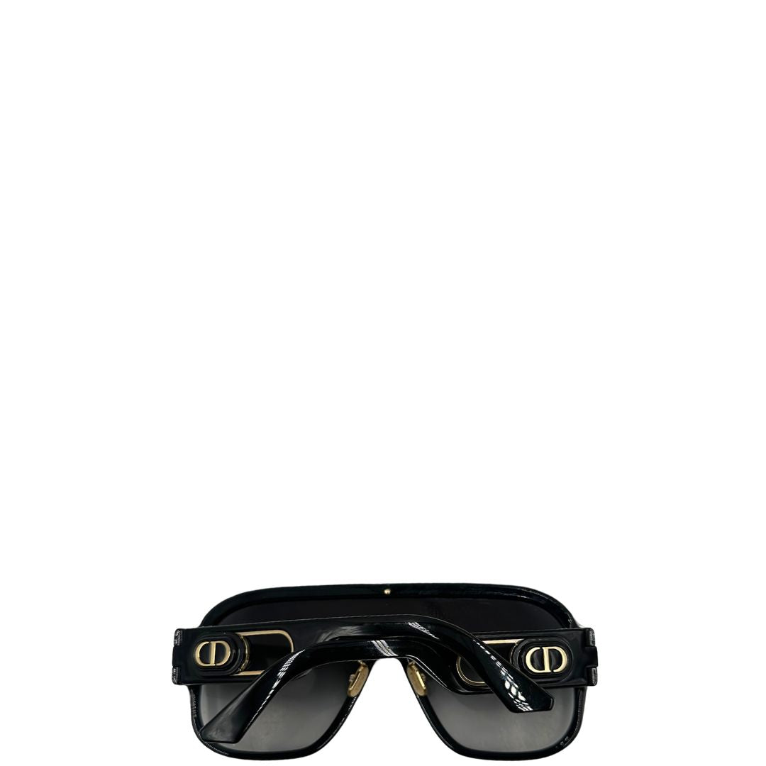 Retro di un paio di occhiali da sole Dior in acetato nero, usati, originali, second hand, in ottime condizioni.