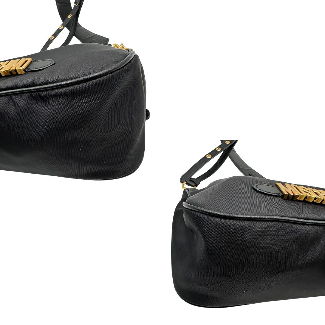 angoli Borsa Moschino in nylon nero, munita di un manico singolo e una tracolla amovibile e regolabile, di lusso, originale, ottime condizioni, usata. 