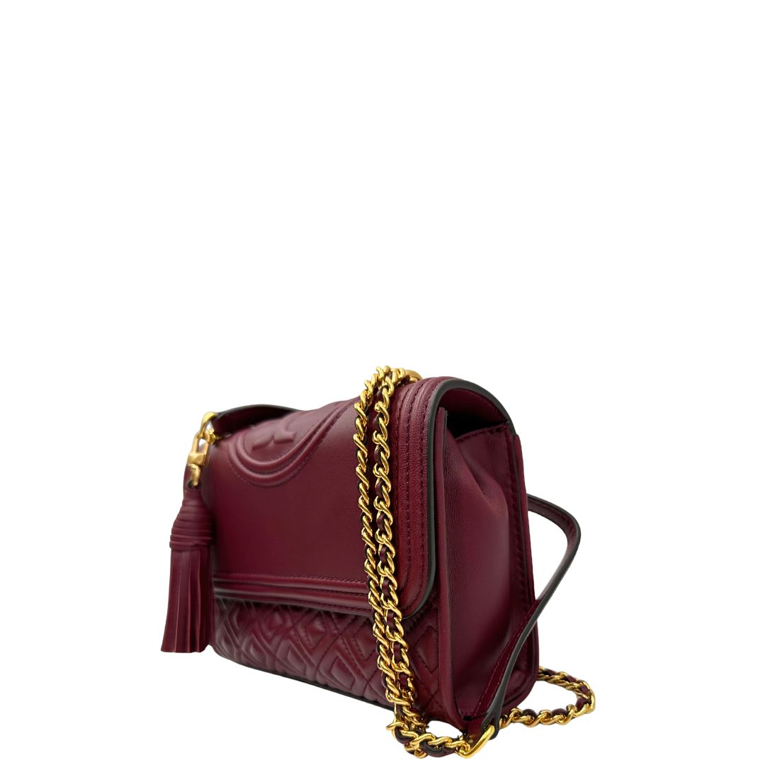 lato  Borsa Tory Burch in pelle bordeaux e hardware dorato, di lusso originale, usata. 